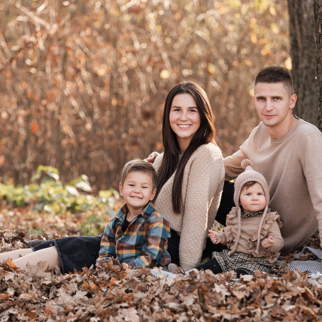 Family in fall foliage scene