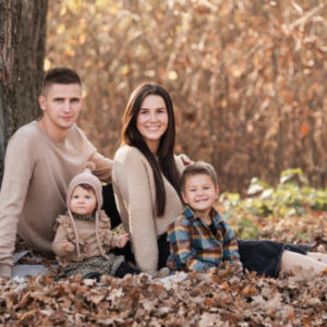 Family in fall foliage scene