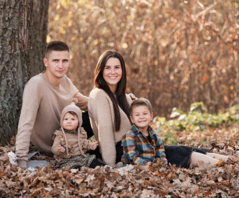 Family in fall foliage scene