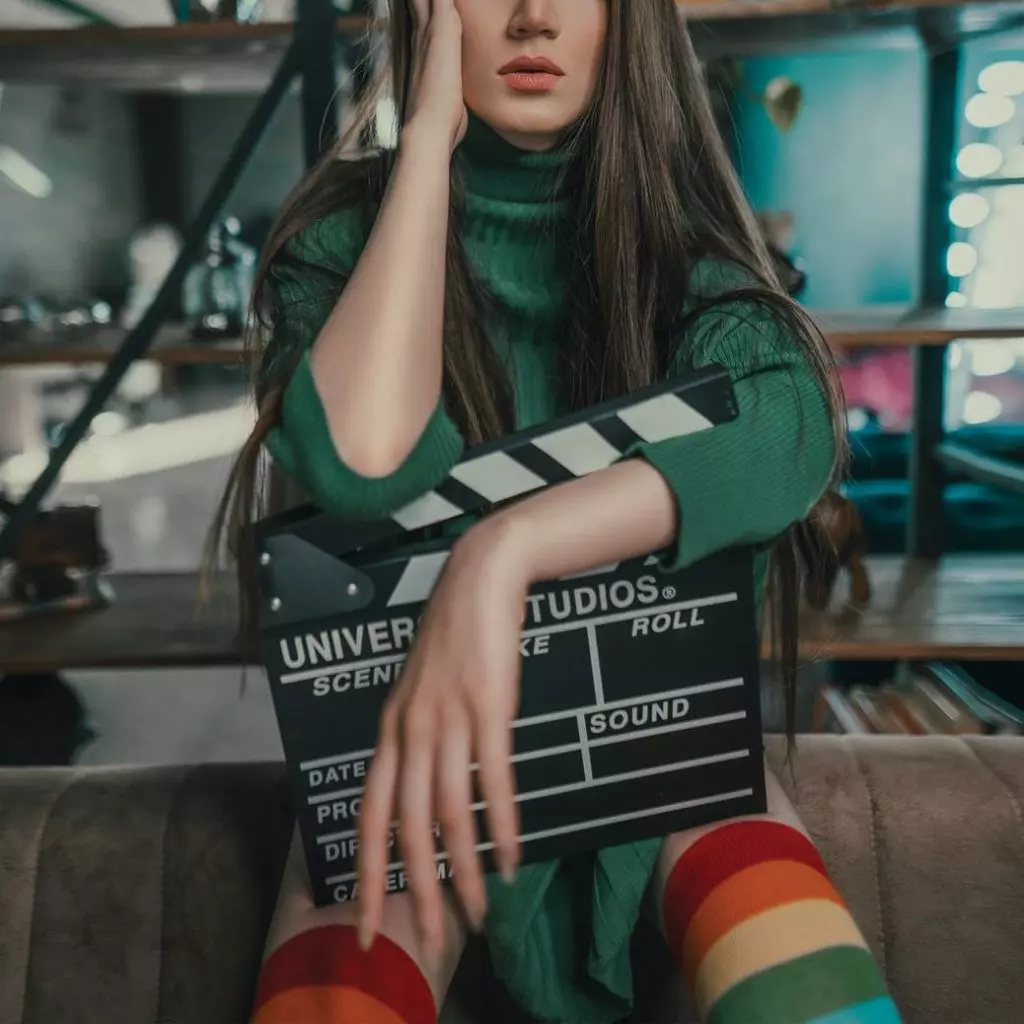 Girl holding clapboard