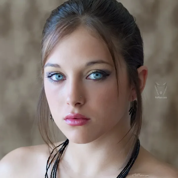 Brittany. blue eyed girl looking at camera