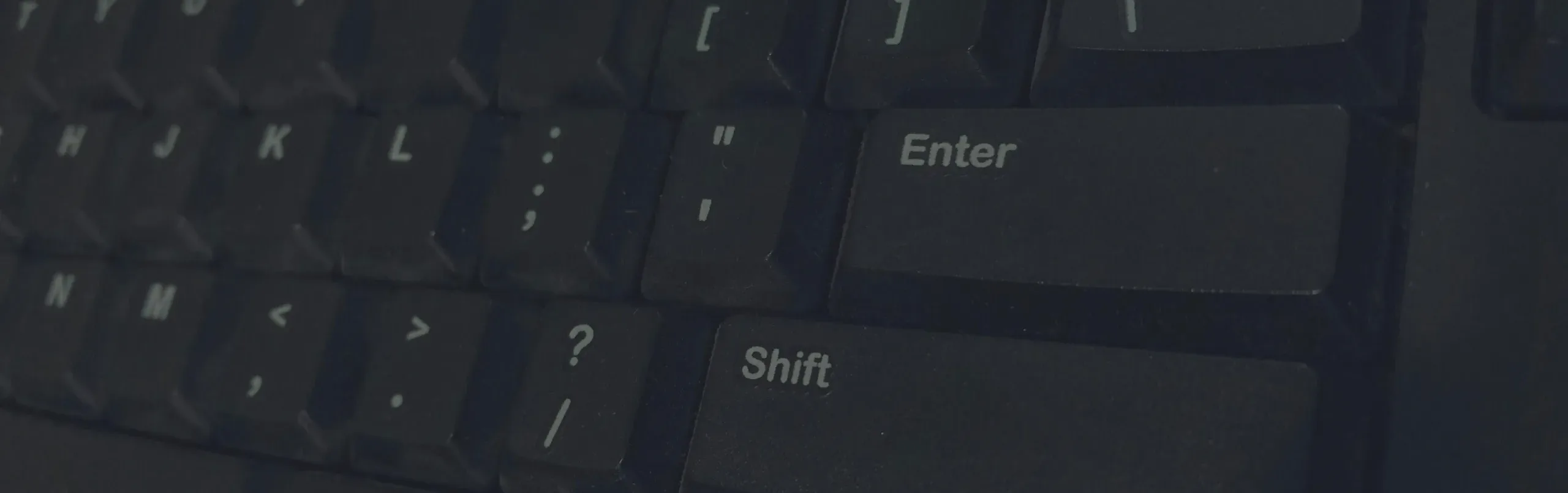 Detailed shot of black computer keyboard showcasing various keys for technology concepts.